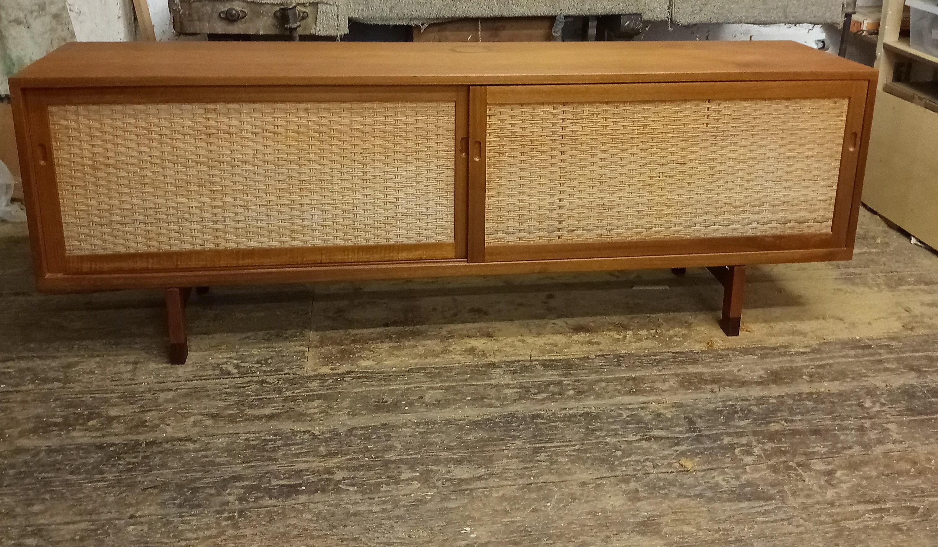 Modell RY 26 Sideboard in Teak by Hans Wegner for Ry Møbler, 1950s
in used condition. 
The sideboard has some signs of use and age.
One big spot on the top