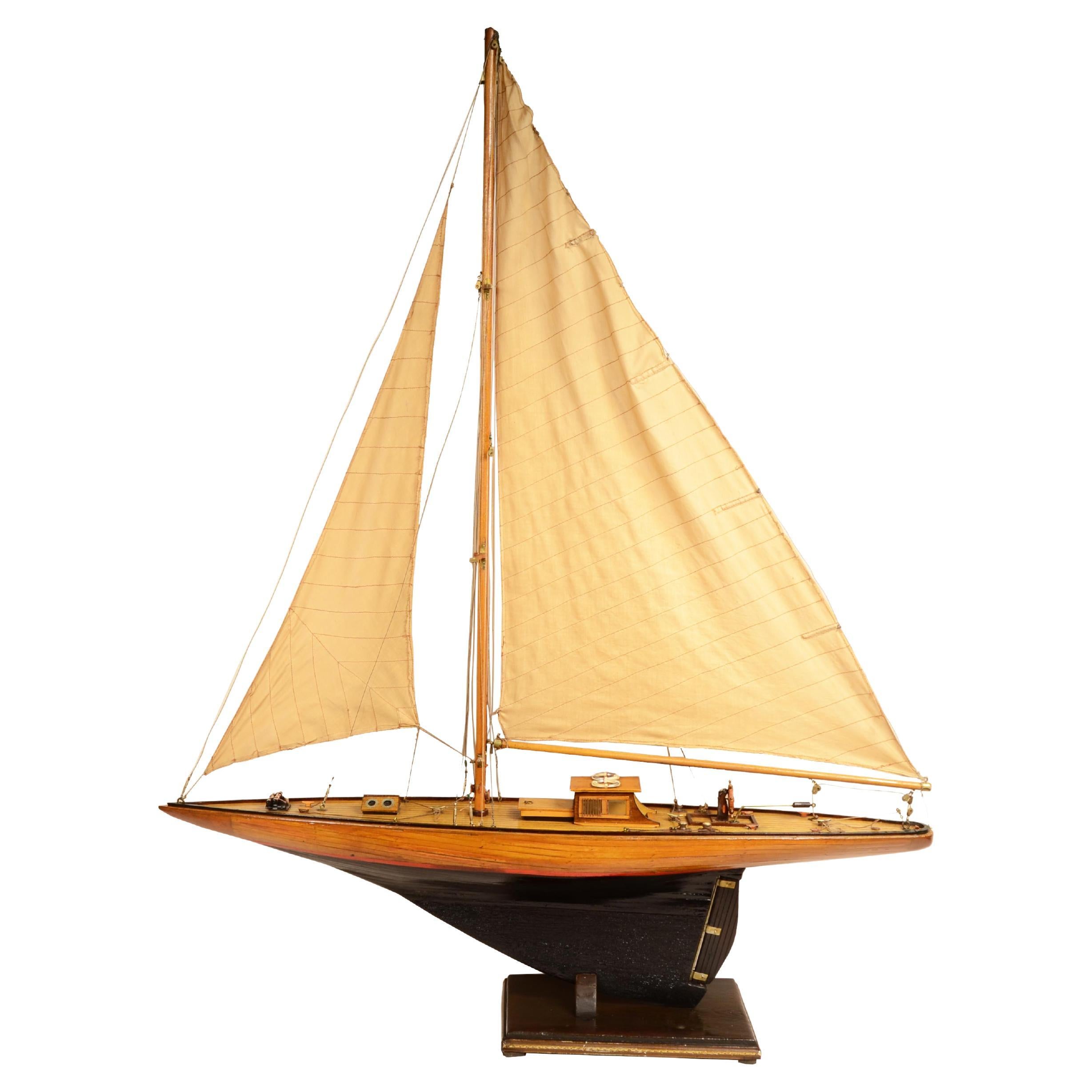 English scale model of recreational sloop with mainsail mast and jib  1930
