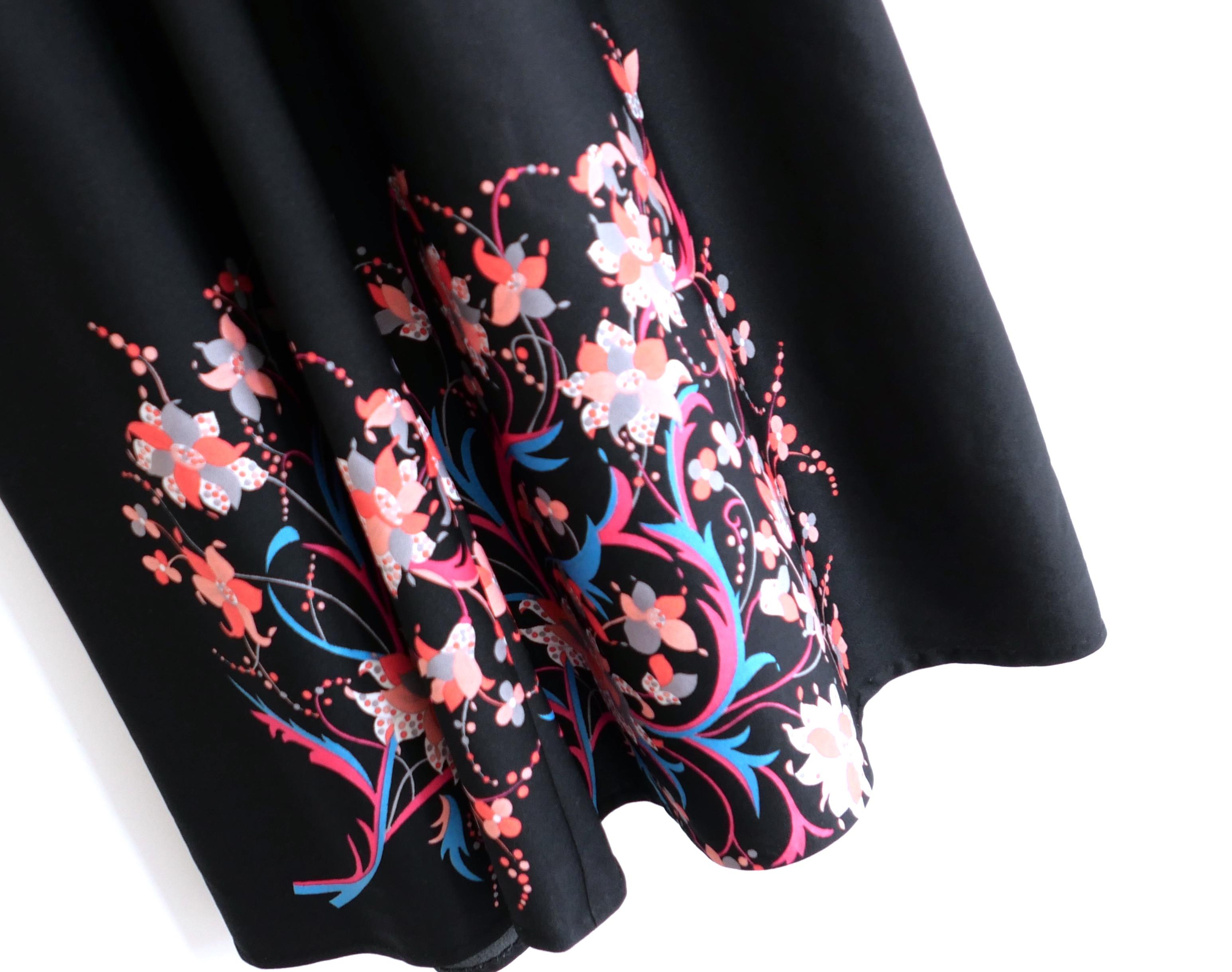 Gorgeous true vintage Modelly 1970s dress - I bought this from Portobello Road around 20 years ago. Made from soft black nylon with a vibrant rococo floral print, it has v neck, a line midi skirt and short sleeves. Has lined skirt and zip to back.