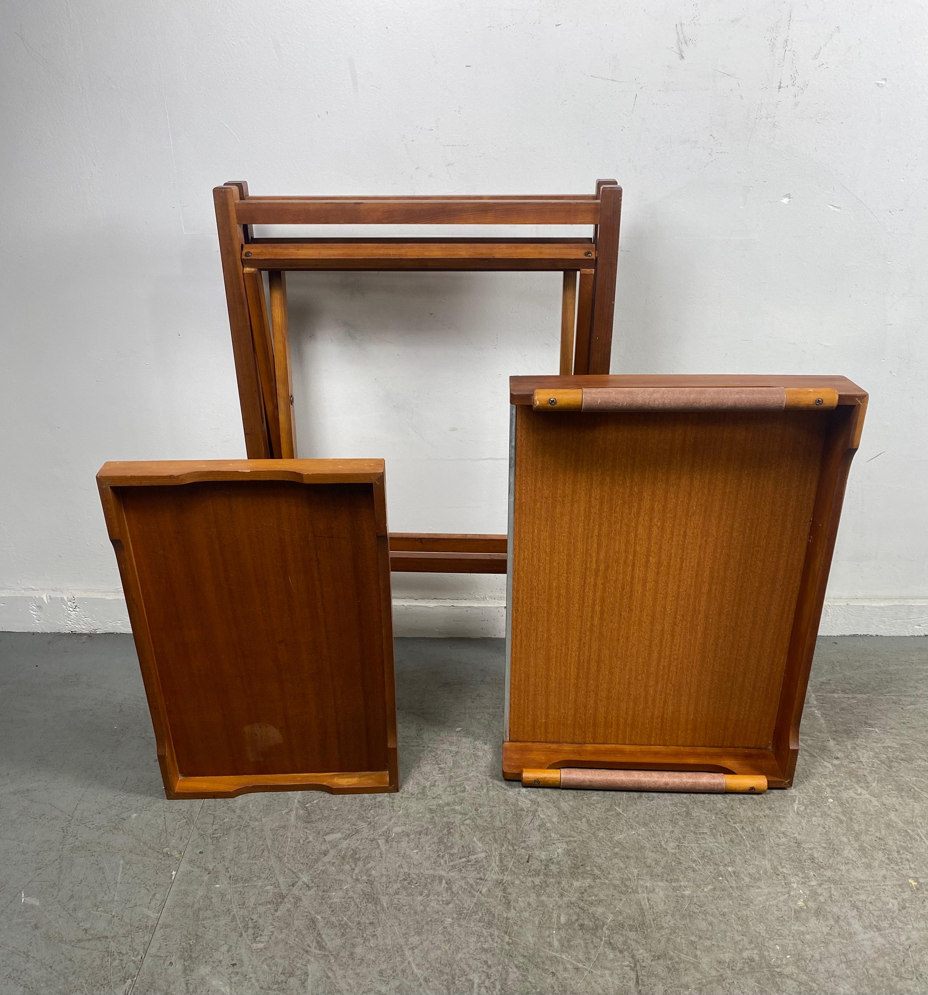 Moderdernist Teak Collapsible bar cart /serving cart attrib Johannes Andersen. Smart design. Three pieces. Leather handled removable tray (top) also center removable tray. Folding base for convenient storage.