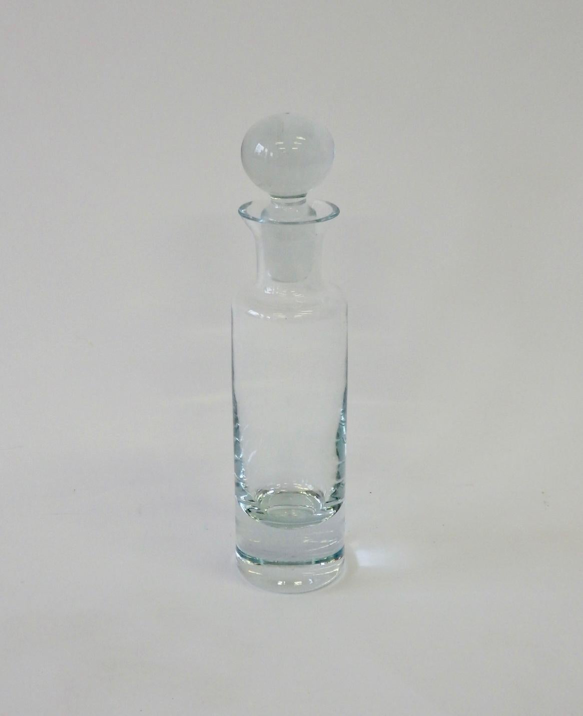 Cylinder form decanter with ball stopper.