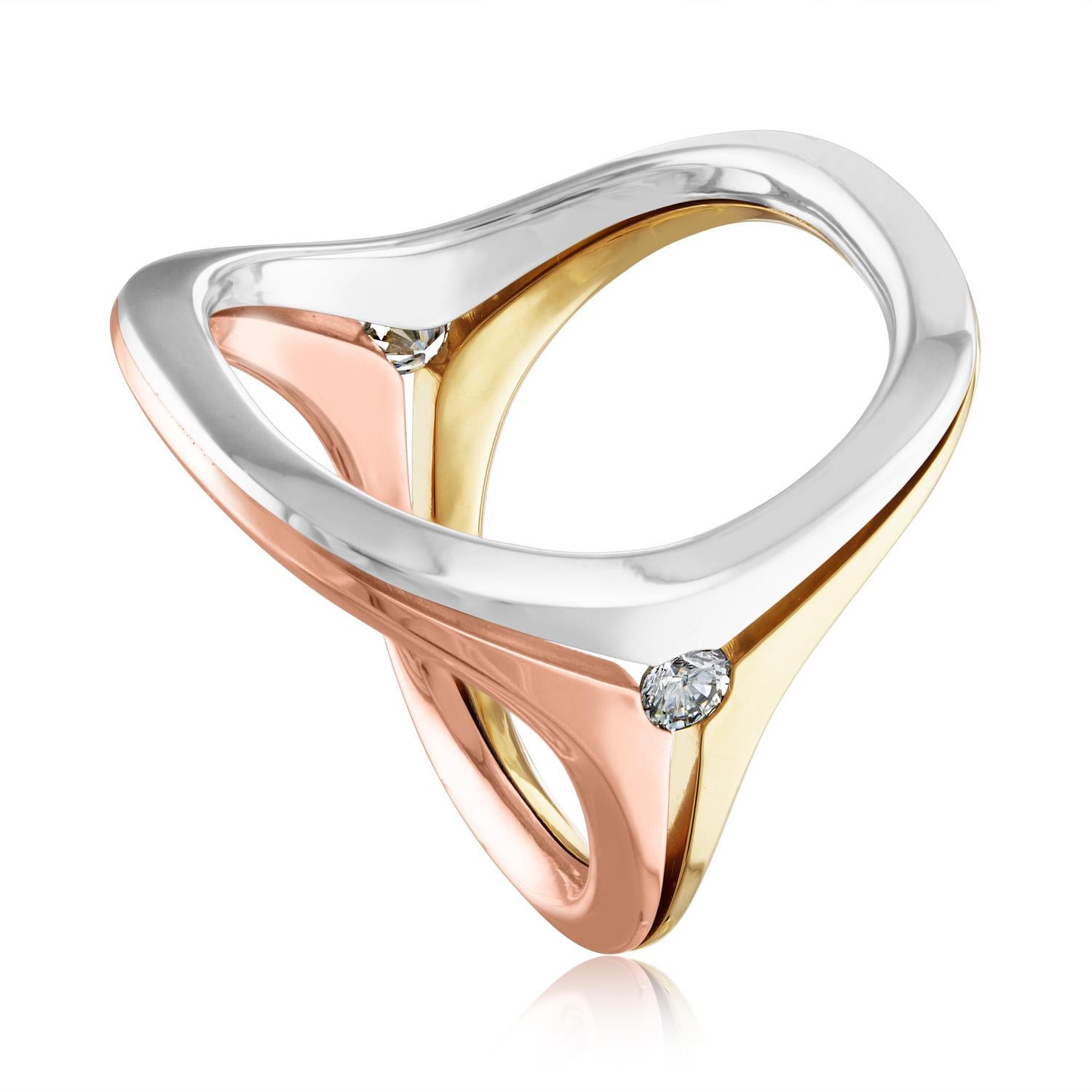 Modernist Tri Color Open Ring
The ring is 18K White Gold, Yellow Gold, Rose Gold
There is 0.20 Carats in diamonds G/H SI
The Modern open design gives the ring a size range.
The ring is a size 7-9, this ring cannot be sized.
It means anyone who wares