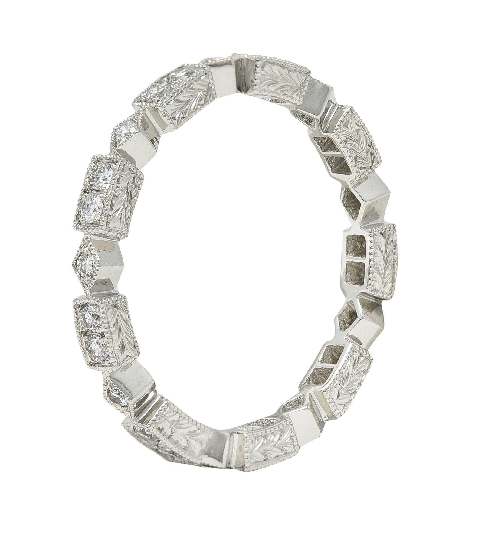 Eternity band ring is comprised of geometric forms with milgrain edging
Navette stations alternating with rectangles - profiles are engraved
Accented by round brilliant cut diamonds
Weighing in total approximately 0.31 carat - eye clean and