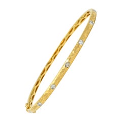 Modern 0.42 Carat Diamond 14 Karat Hammered Gold Bangle Bracelet