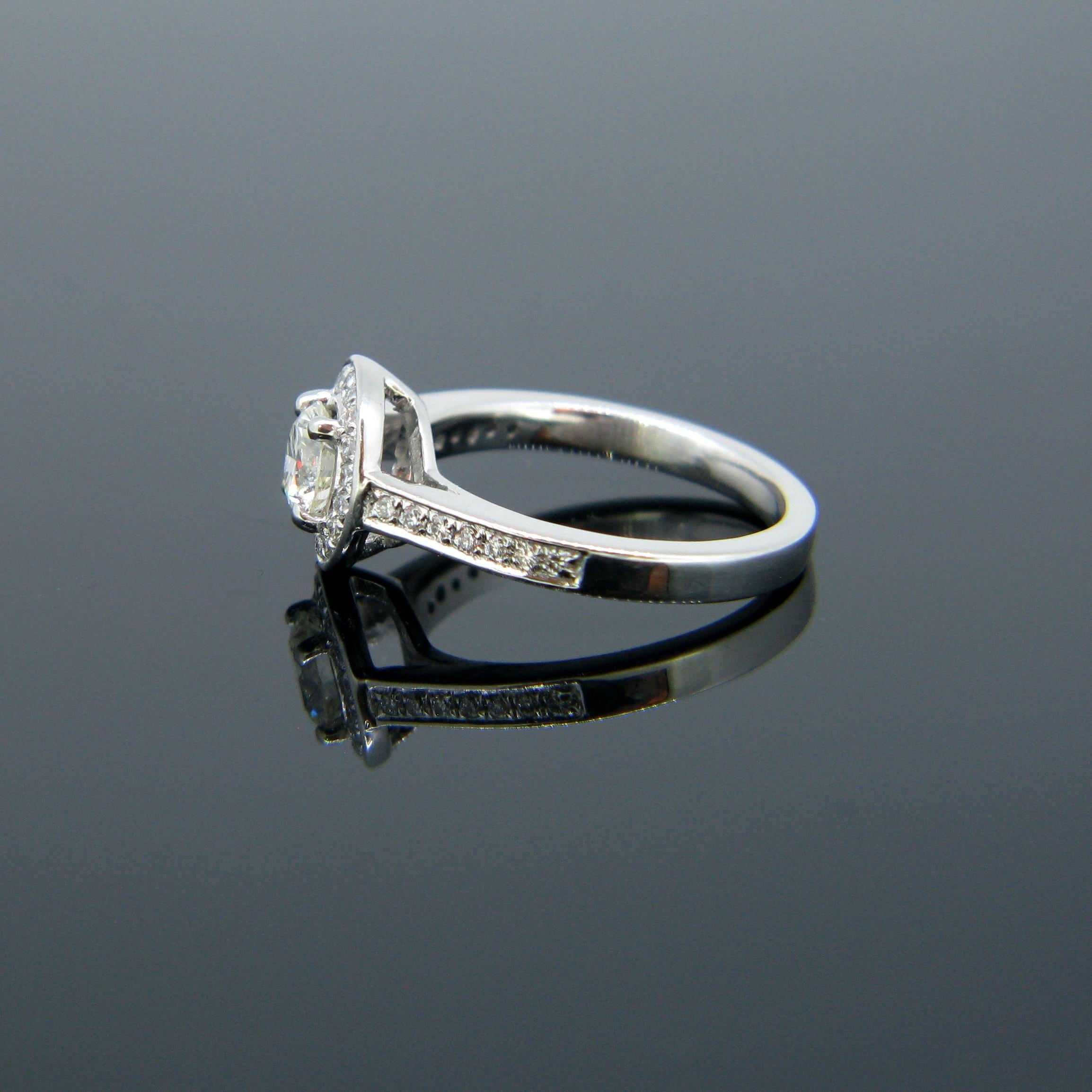 Round Cut Modern 0.63 Carat Diamond Halo Cluster Platinum Engagement Ring For Sale