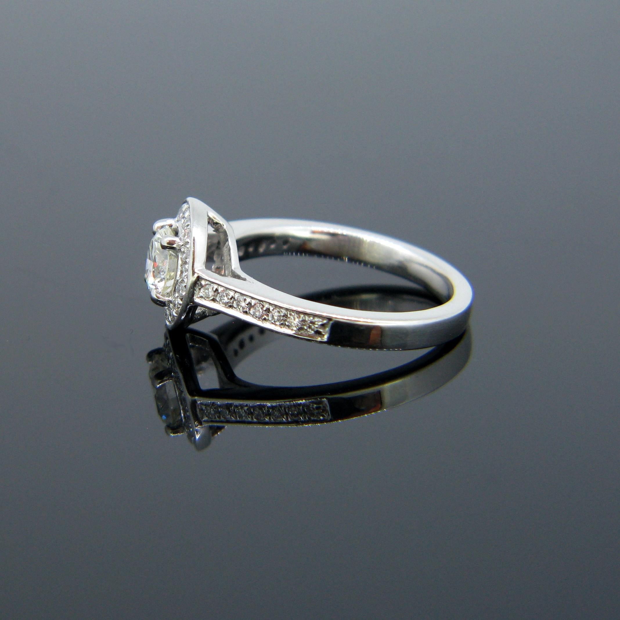 Modern 0.63 Carat Diamond Halo Cluster Platinum Engagement Ring In New Condition For Sale In London, GB