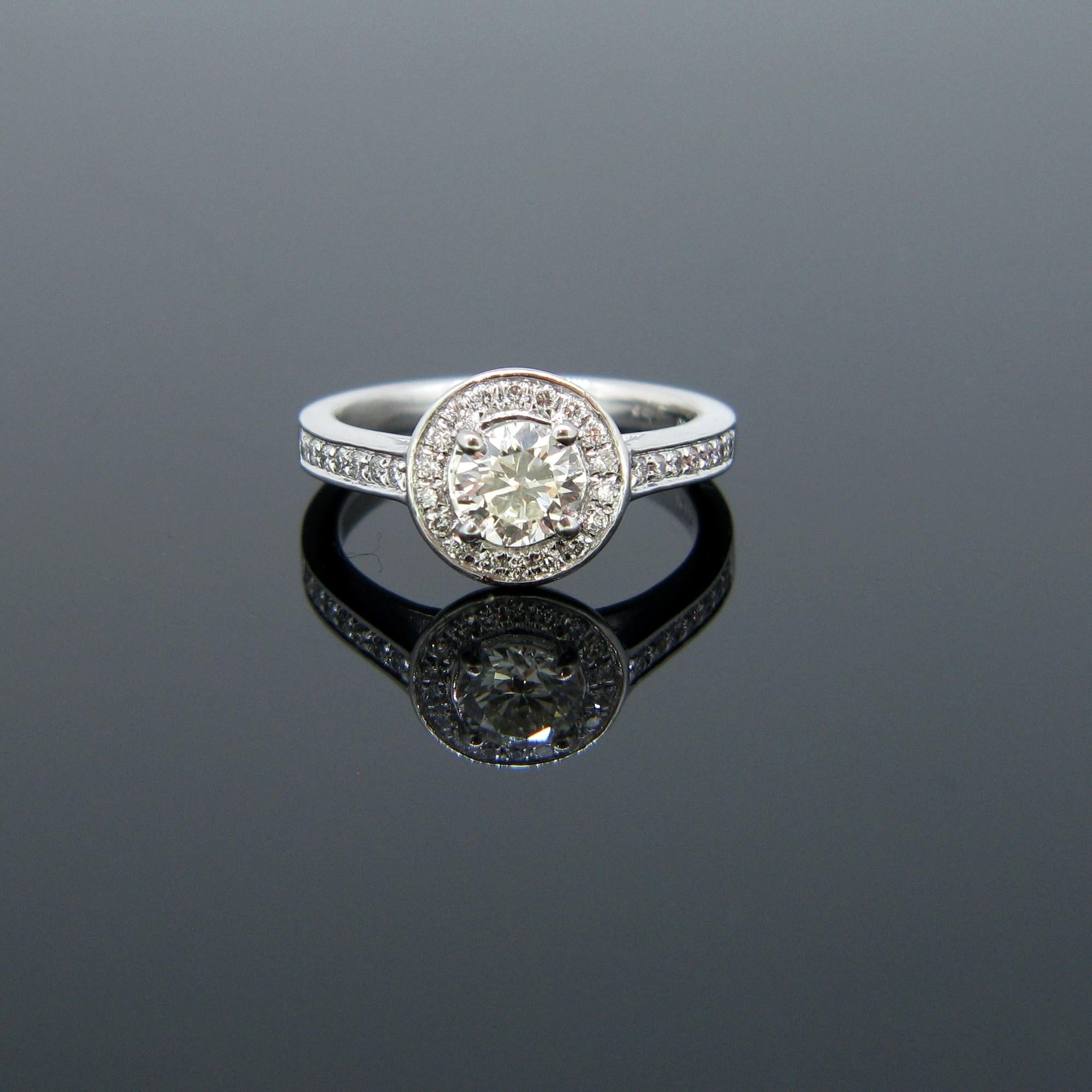 Modern 0.63 Carat Diamond Halo Cluster Platinum Engagement Ring For Sale 1