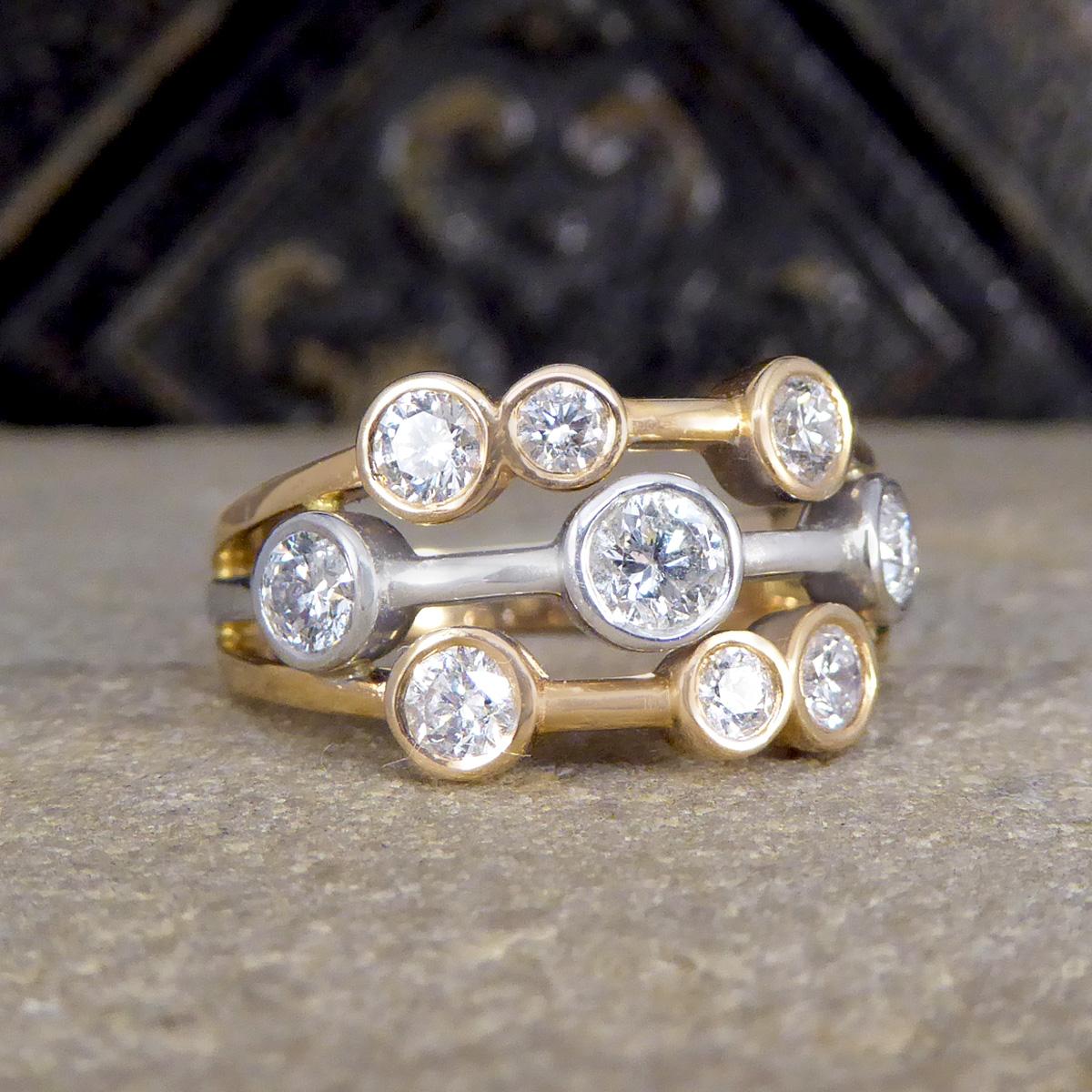 A beautifully and bubbly ring. This bubble ring has nine different sized Diamonds spread evenly along three strands creating a sparkle across the whole head of the finger. There are a total of 0.90ct Modern Brilliant Cut Diamonds that are bright and
