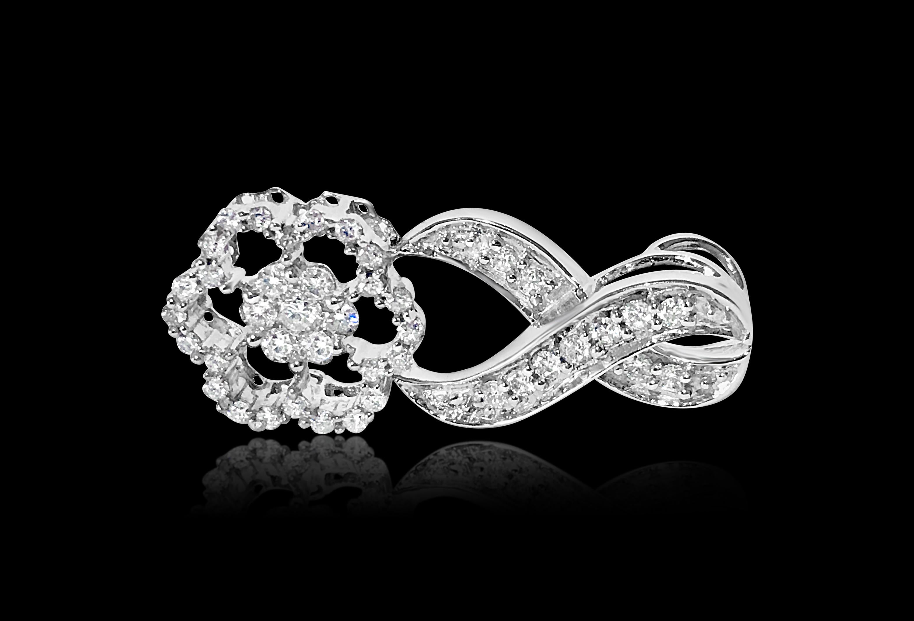 Metal: 14K white gold. 
1.25 carat diamonds. VS-SI clarity and G color. Round brilliant cut diamonds. Clean diamonds and excellent luster. Beautiful infinity design. Modern designer pendant. 
Chain not included with this piece. 
