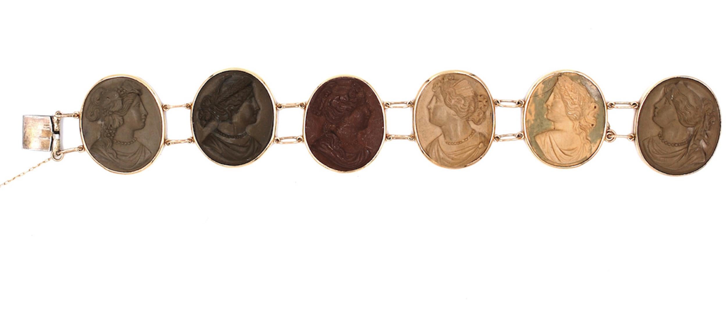 Vintage, 14 karat Hand Carved, Lava Cameo Bracelet 
Measuring 8 inches in length this beautiful bracelet is made of 14 karat yellow gold bezel setting, securing 6 cameos. Each cameo is a different carving and measure 1 ½ x 1 inch width 
Links