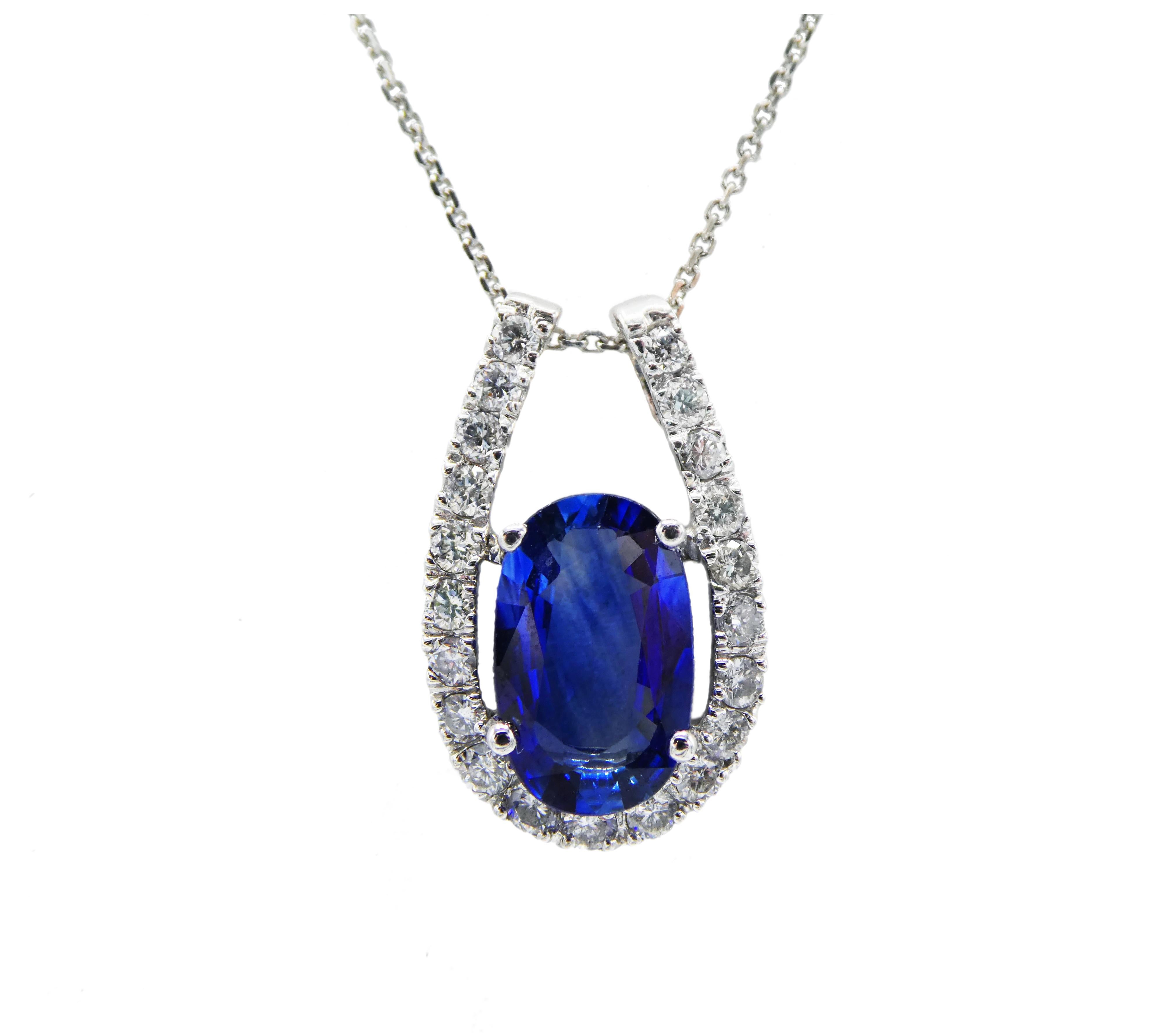 Modern 14K White Gold Pave Diamond & Blue Sapphire Drop Pendant Necklace 

Metal: 14k white gold
Weight: 3.41 grams
Diamonds: 21 round brilliant cut diamonds, approx. .42 CTW G-H SI
Blue Sapphire: Oval, 10mm x 6.2mm x 3.3mm, approx. 1.50