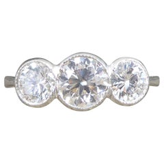 Modern 1.45 Carat Brilliant Cut Diamond Collar Set Three Stone Ring in Platinum