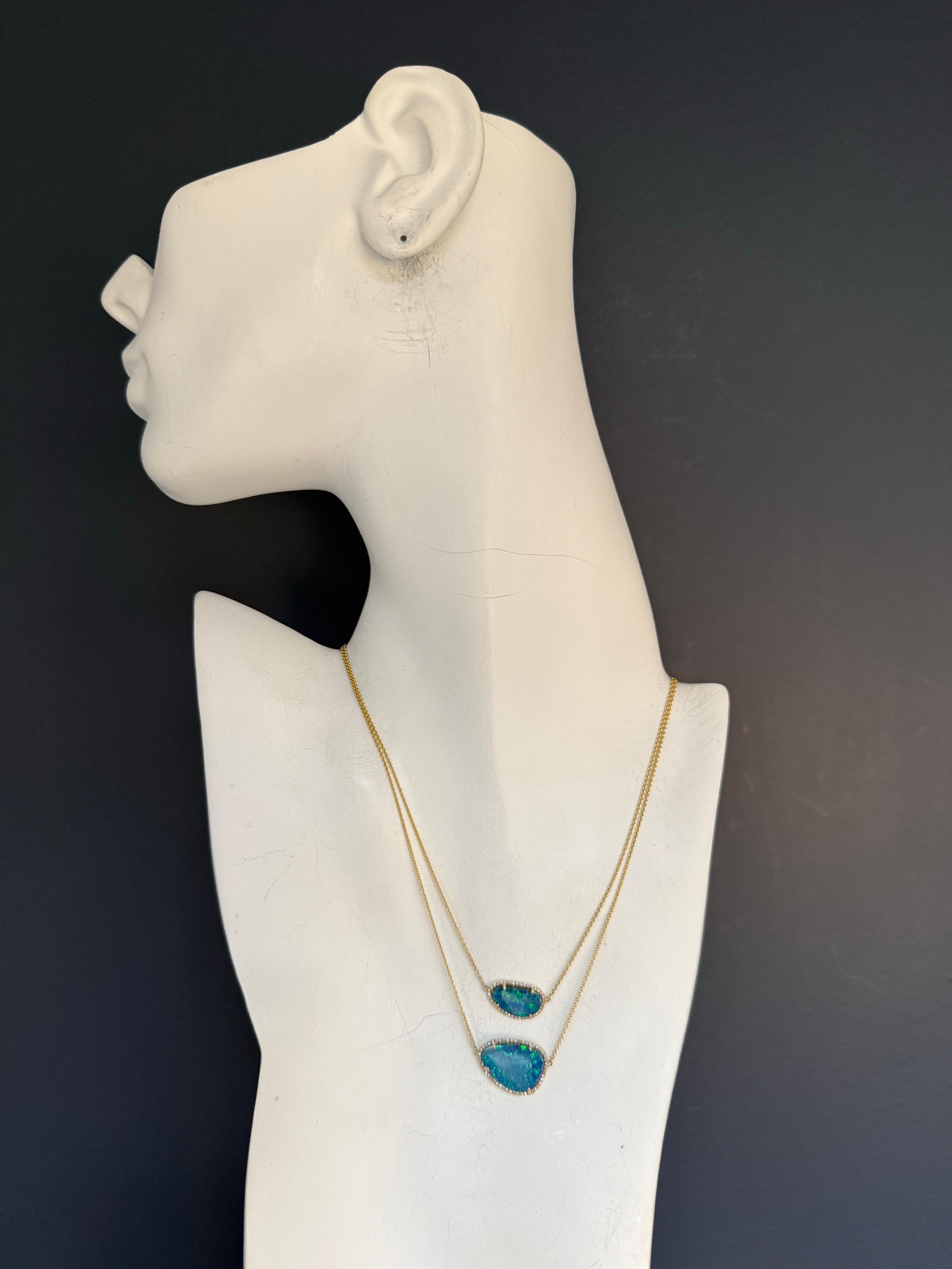 Modern 14K yellow gold two-strand necklace featuring opal doublets, each framed by a delicate halo of natural micro-set diamonds graded approximately H–I in color. The necklace measures 18 inches in total length with additional loops at 17 and 16