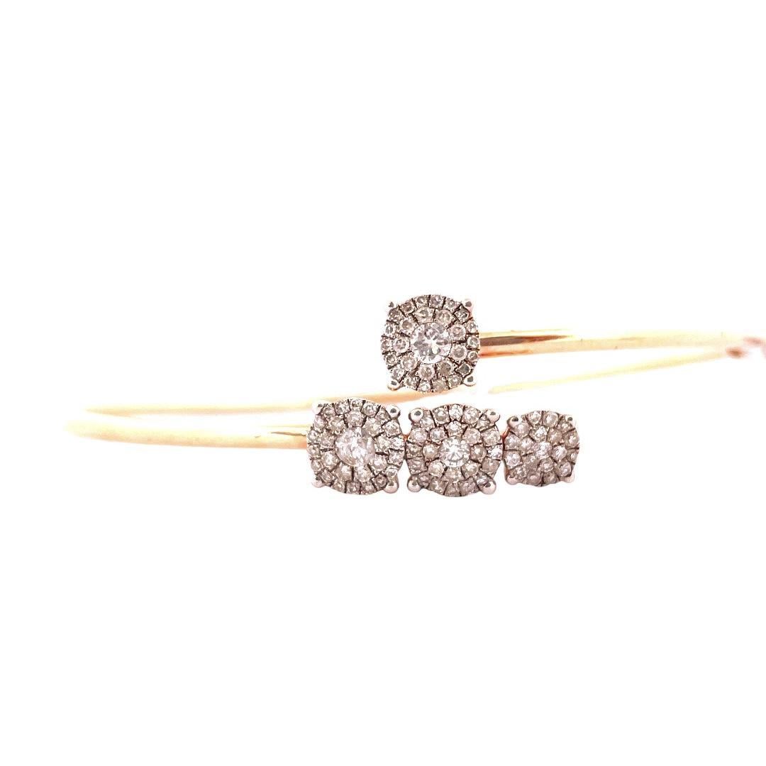 Indulge in timeless glamour with our exquisite 14K Rose Gold Diamond Bangle, a dazzling statement piece that radiates sophistication and elegance. 
This bangle, weighing 5.05 grams, boasts a total carat weight of 0.75, with brilliant diamonds set in