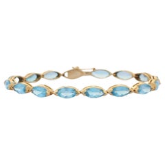 Modernes Tennisarmband aus 14 Karat massivem Gelbgold mit 18,9 Karat blauem Topas im Marquise-Schliff