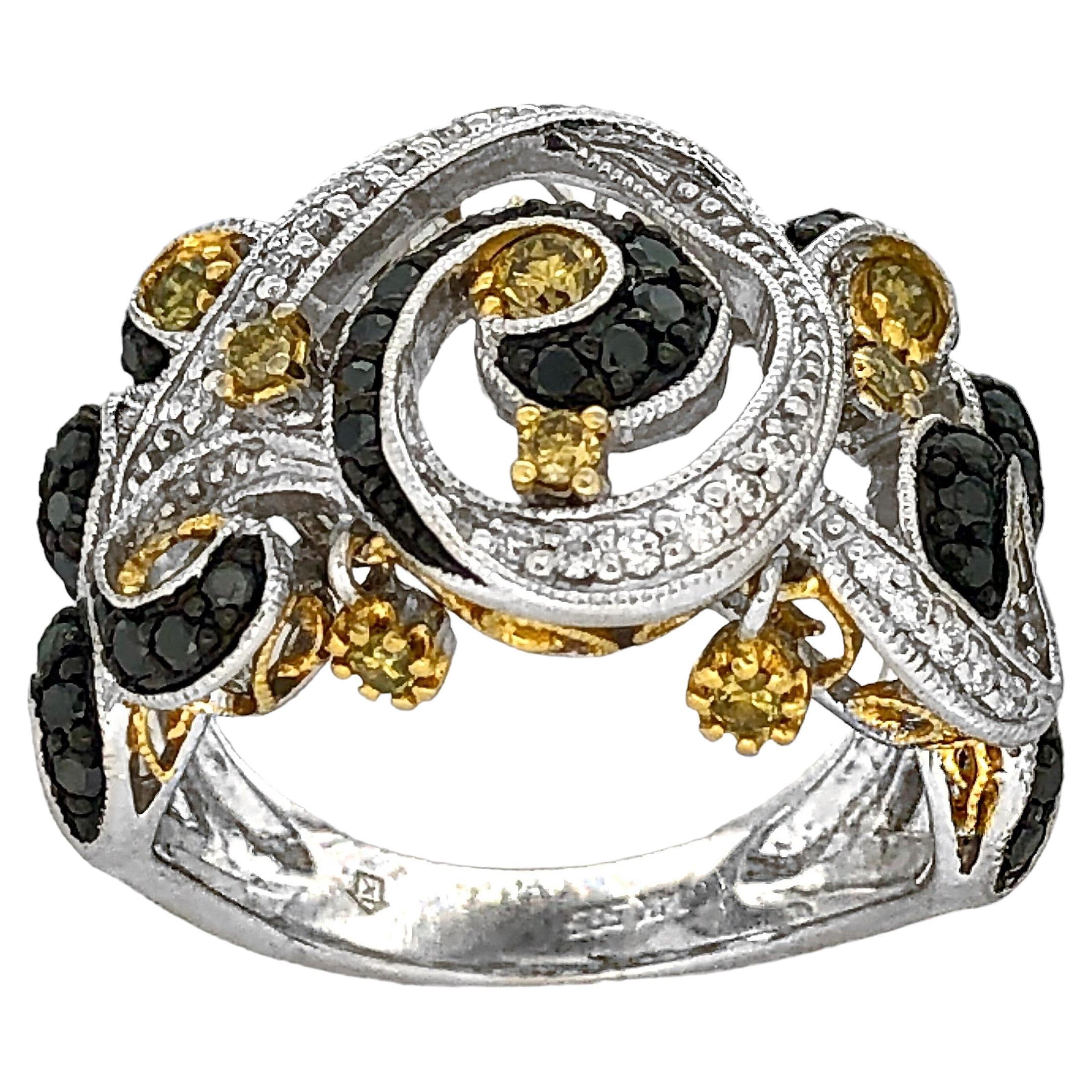 This modern 14K white gold ring is set with white, black and fancy yellow diamonds, all in billowing swirls. The effect is truly that of the piece being in motion. Total approximate diamond weight is 1.50ct.  Ring  size 5 3/4.  Stamped inside are