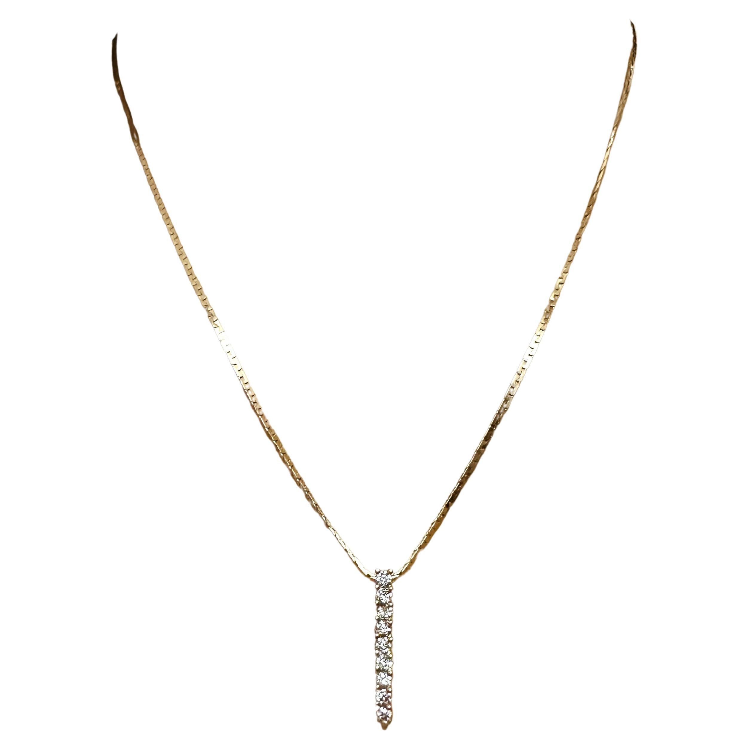 I just love this necklace!  The design is just so cool.  It has 9 brilliant cut diamonds measuring approximately 2.4 x 2.4 x 1.8 mm.  To my untrained eye the color appears to be H-I.  They total approximately .54 carats.  The necklace is 16 inches
