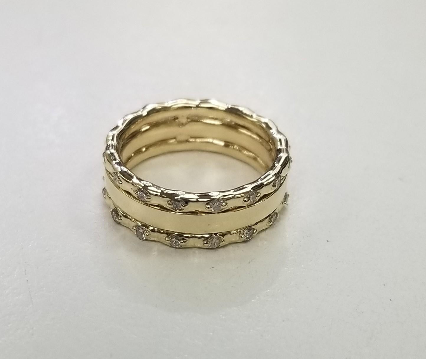 Modern 14k Yellow Gold Diamond Ring
Specifications:    
    GEMSTONE: 32 round Diamonds
    carat total weight: .42pts. 
    diamond quality: Color F-G and Clarity VS 
    width: 6 mm    
    metal: 14K YELLOW GOLD
    type: BAND ring
    weight: 