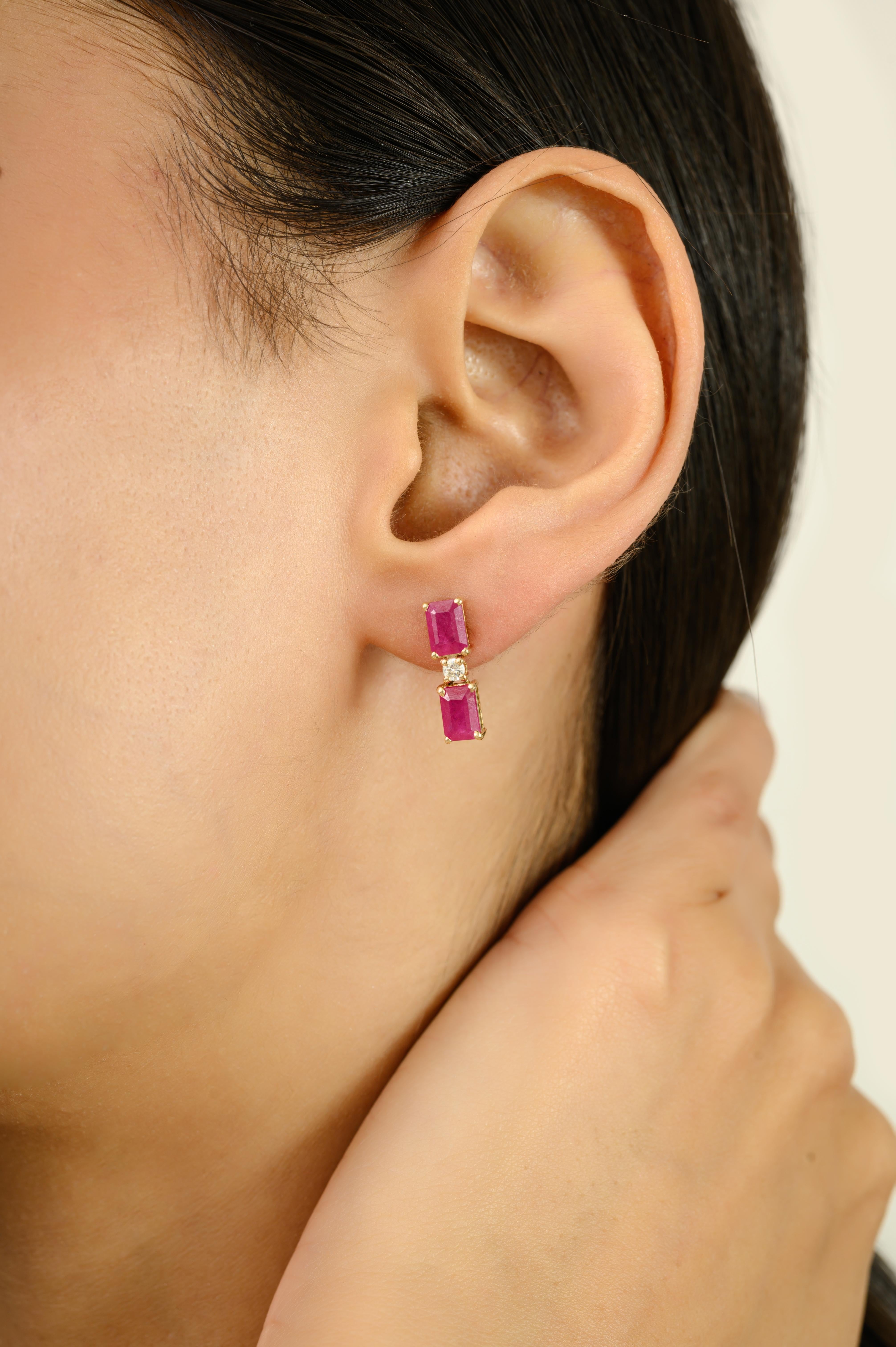 Elevate your elegance with these Modern 14k Yellow Gold Emerald-Cut Ruby & Diamond Drop Stud Earrings . Featuring a total ruby weight of 3.02 carats and diamond accents weighing 0.11 carats, these earrings showcase vibrant, richly saturated rubies