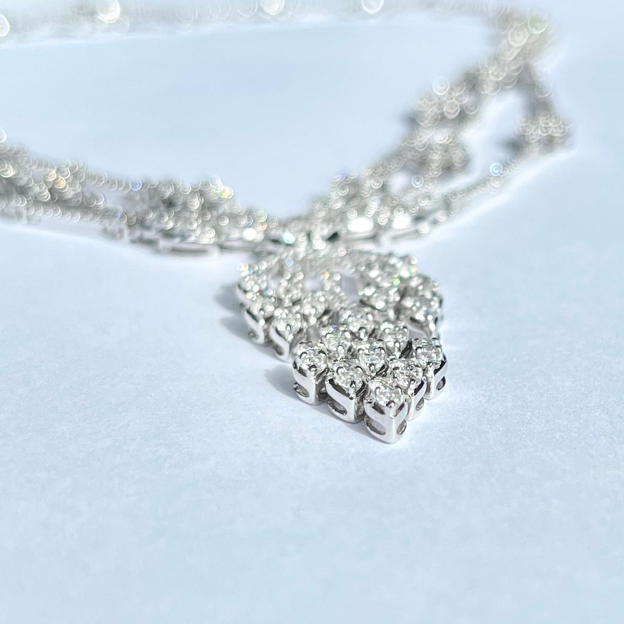 The bright white diamonds are natural, clean stones. They total approx 10carats and this stylish necklace is modelled in 18 carat white gold. The necklace is completely encrusted with these beautiful stones and has wonderful sparkle under any light.