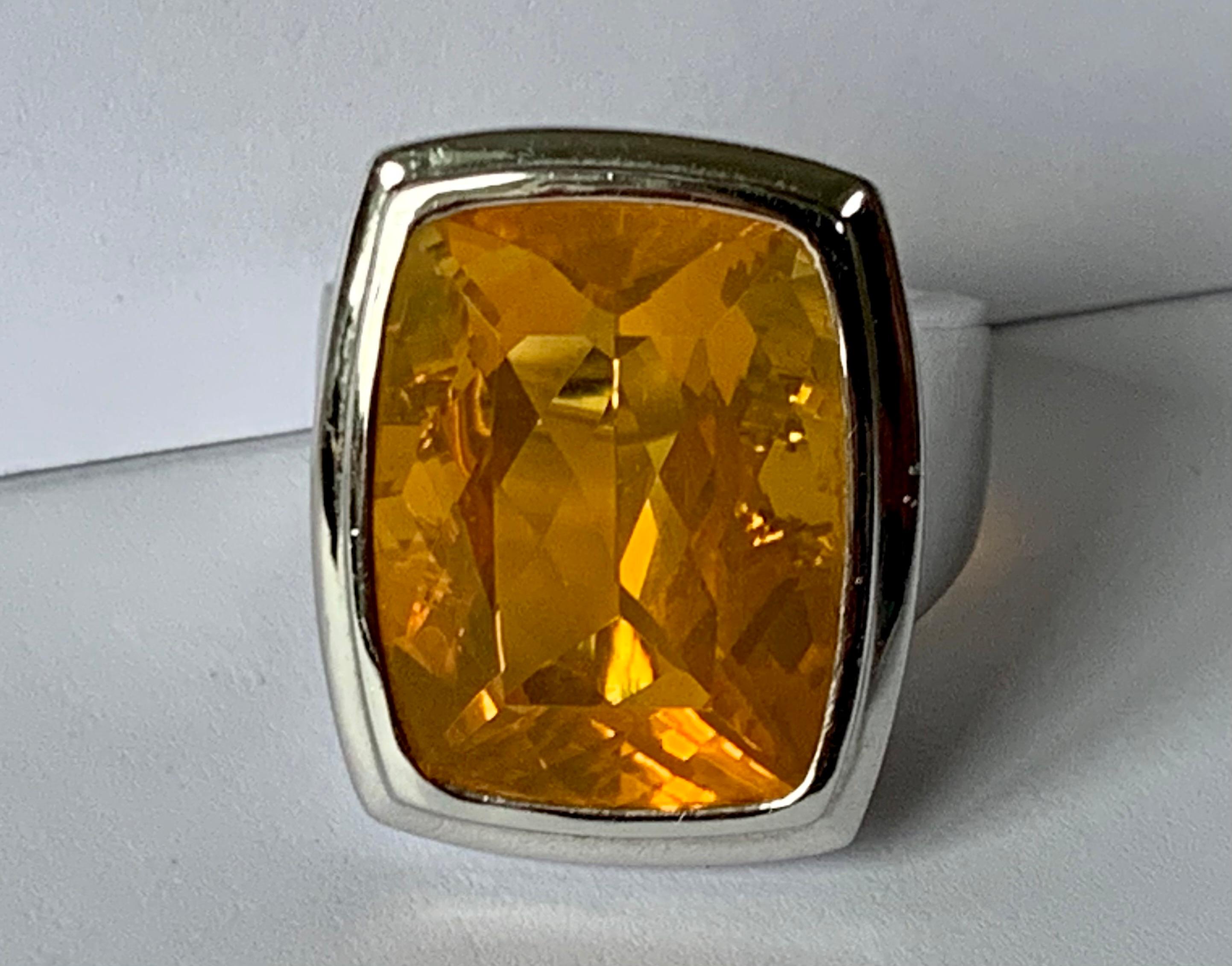 Elegant and sophisticated  solid 18 K white Gold Ring set with a beautiful mexican Fire Opal weighinig 16.12 ct. 
The ring is currnently size 56/16 but can easily be resized. 
Matching earflaps available!
Masterfully handcrafted piece! Authenticity