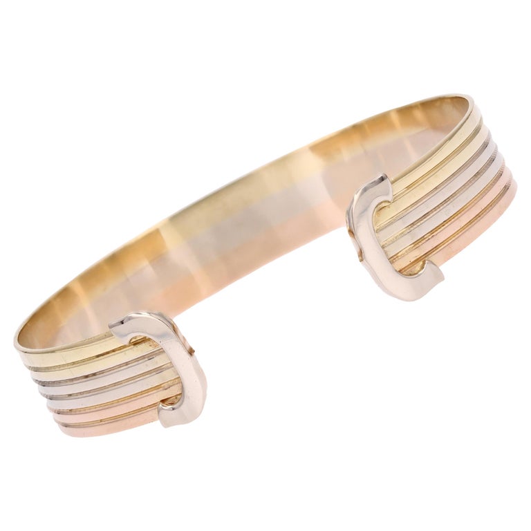 Bracelet jonc moderne double C de style Cartier en or 18 carats