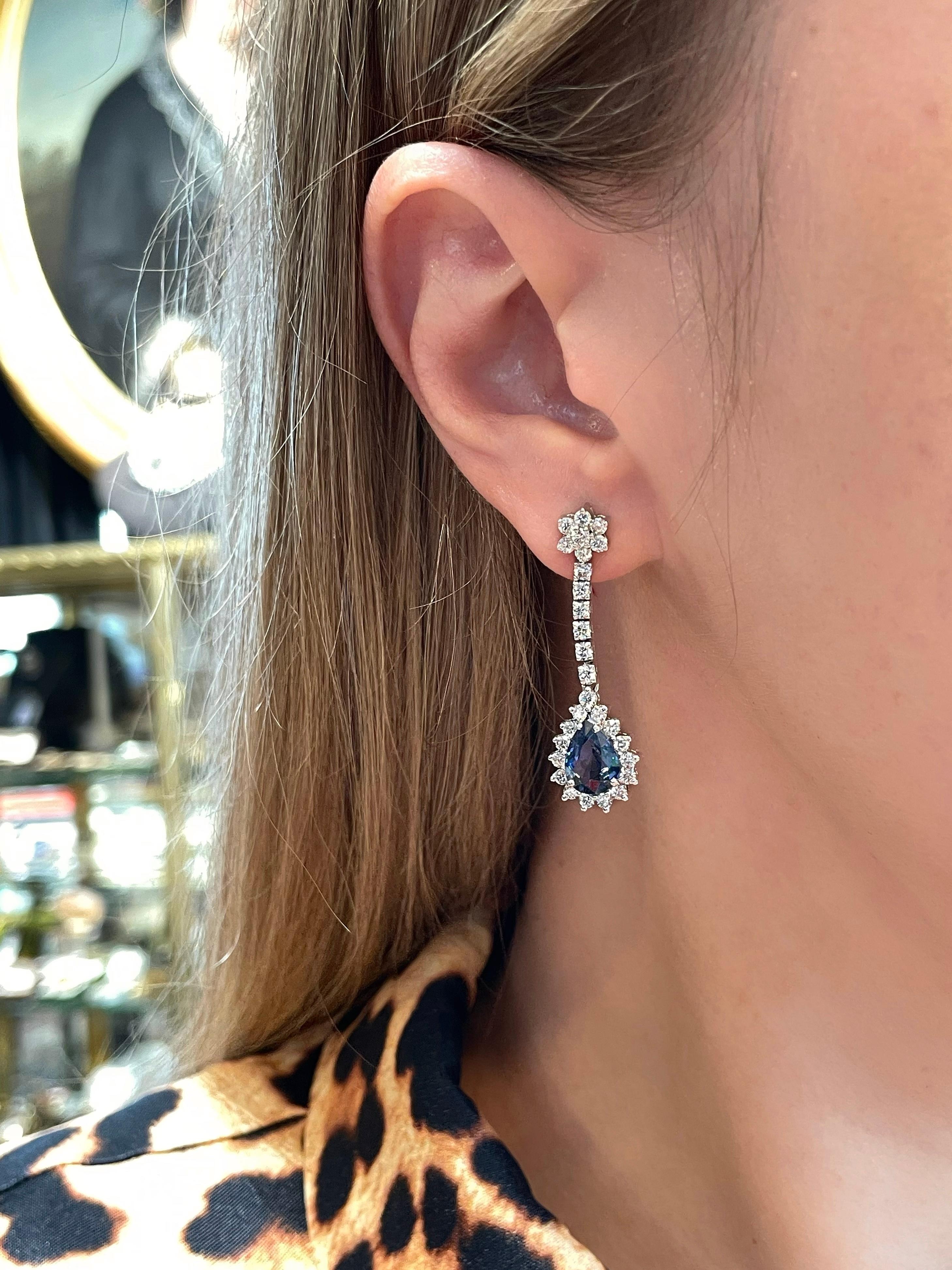 This is a stunning pair of modern design drop stud earrings. It is crafted in 18K gold. Circa 2010. 

The piece features:
- 2 sapphires, pear cut, TW 4.20ct, B 6/3, VS-SI
- 56 diamonds, round brilliant cut, TW 1.70ct, RW-W, SI

Weight: 9.98g
Length:
