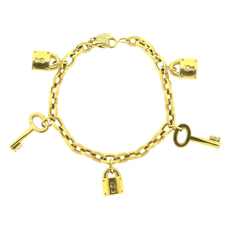 Modern 18 Karat Gold Padlock and Key Charm Bracelet For Sale at 1stDibs