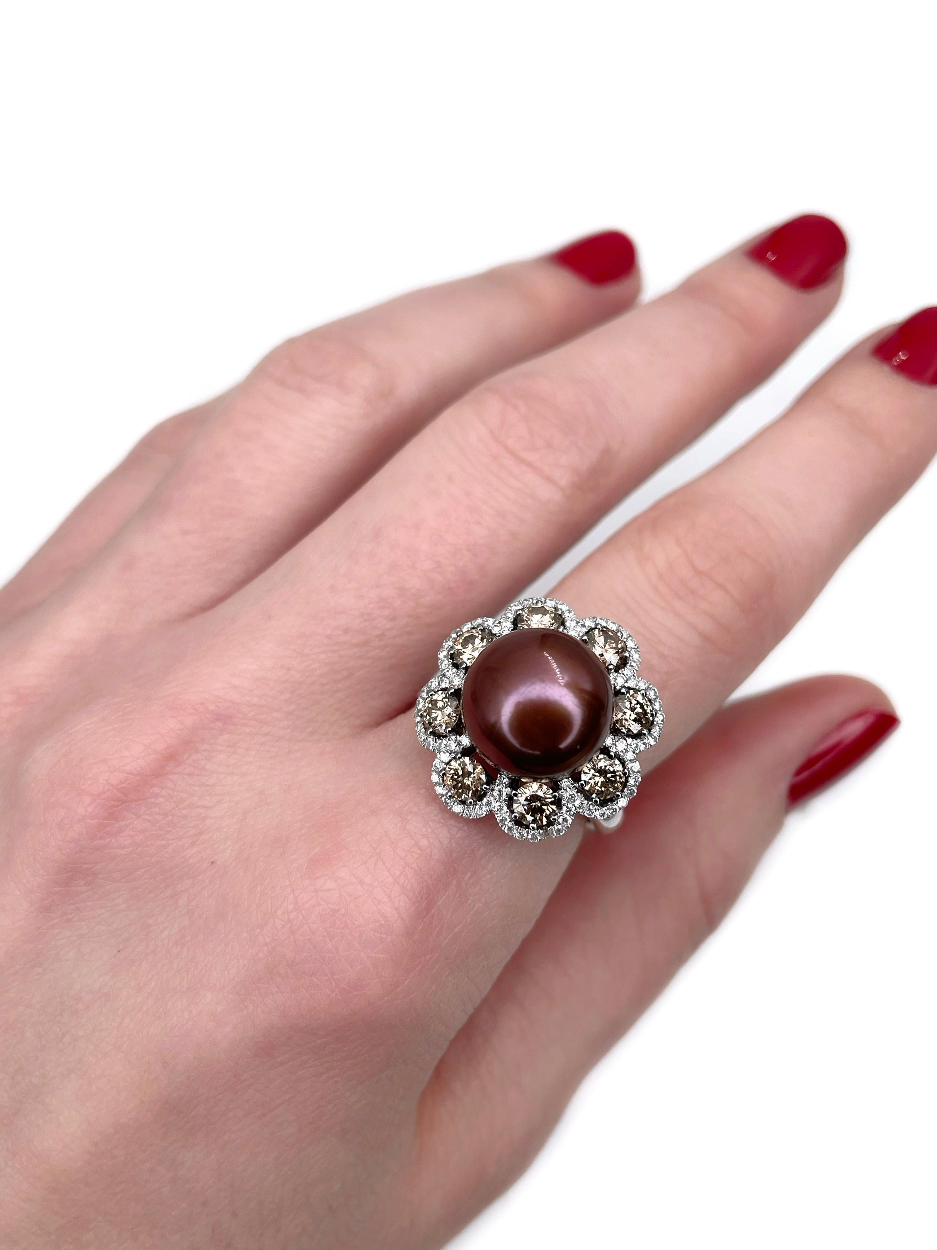 This is a modern design cocktail ring crafted in 18K white gold. Circa 2010. 

The piece features: 
- 1 pearl (cultured, Tahitian, chocolate brown colour)
- 88 diamonds (round brilliant cut, TW 0.40ct, RW-W, VS-SI)
- 8 diamonds (round brilliant cut,