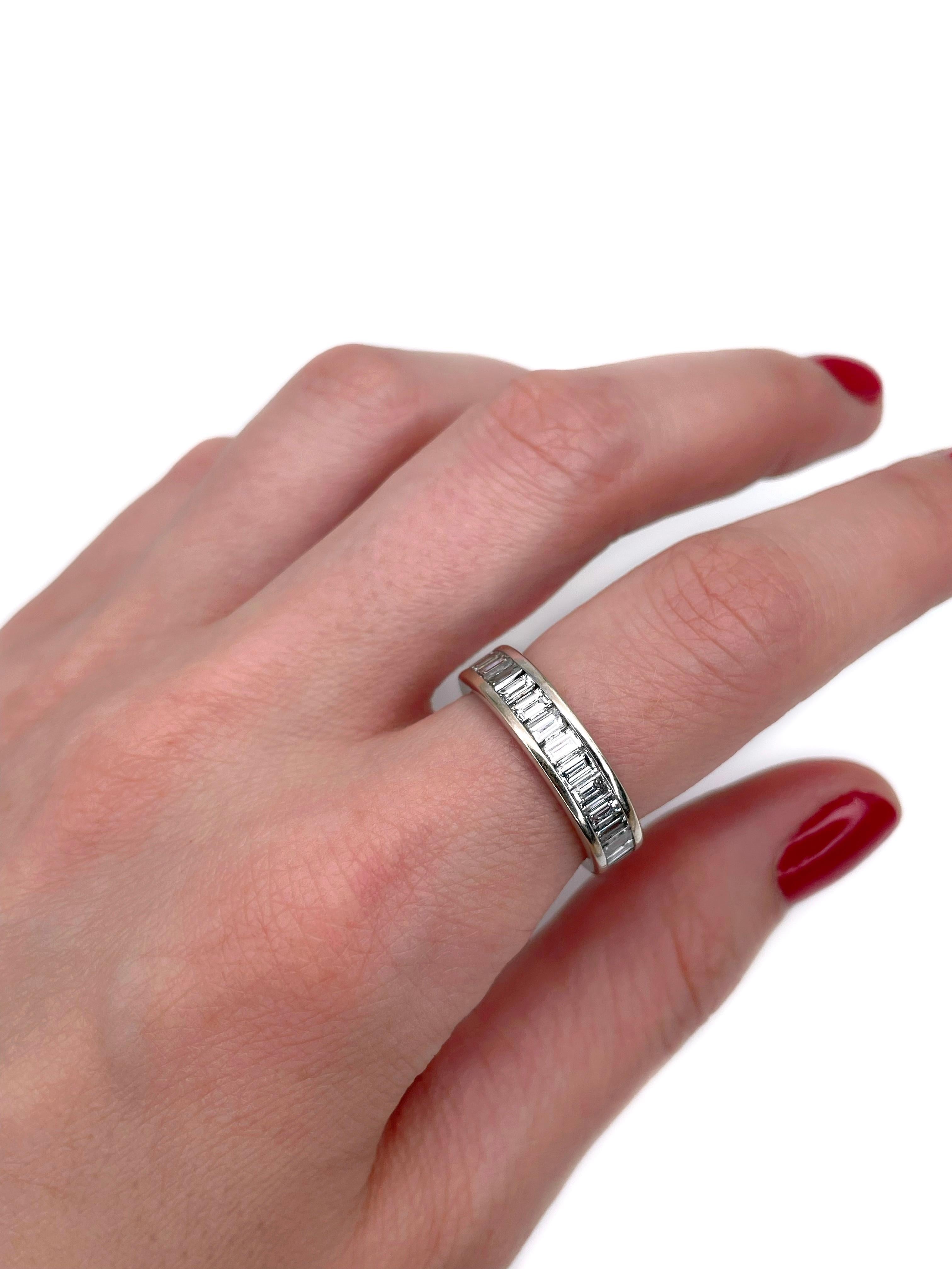 This is a modern band ring crafted in 18K white gold. Circa 2000. 

It features 18 diamonds (rectangular step cut, TW 1.40ct, RW-W, VS-SI). 

Weight: 7.95g
Size: 17.25 (US 7)

IMPORTANT: please ask about the possibility to resize before purchase.