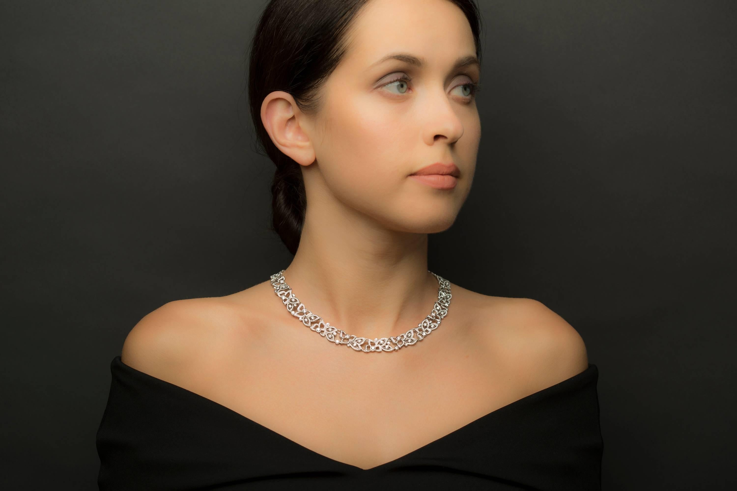 Reaching a new level of complexity and craftsmanship, this piece showcases the entire year Carelle's skilled artisans worked to perfect its form, fit and scale.  This 18 karat white gold floral garland collar necklace features a whopping 8.5 carats