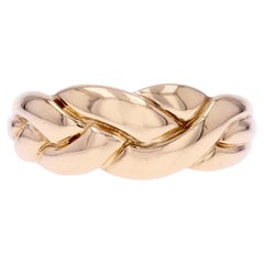 Anillo brazalete trenzado moderno de oro amarillo de 18 quilates