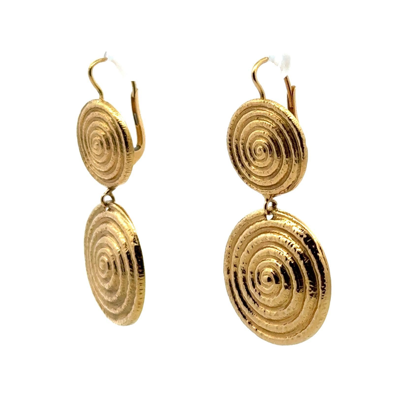 Modern circlular drop earrings offer a contemporary twist on classic elegance. Crafted from 18 karat yellow gold, these earrings  boast a rich, warm hue that exudes luxury. The high karat purity ensures durability and a lasting shine. The earrings