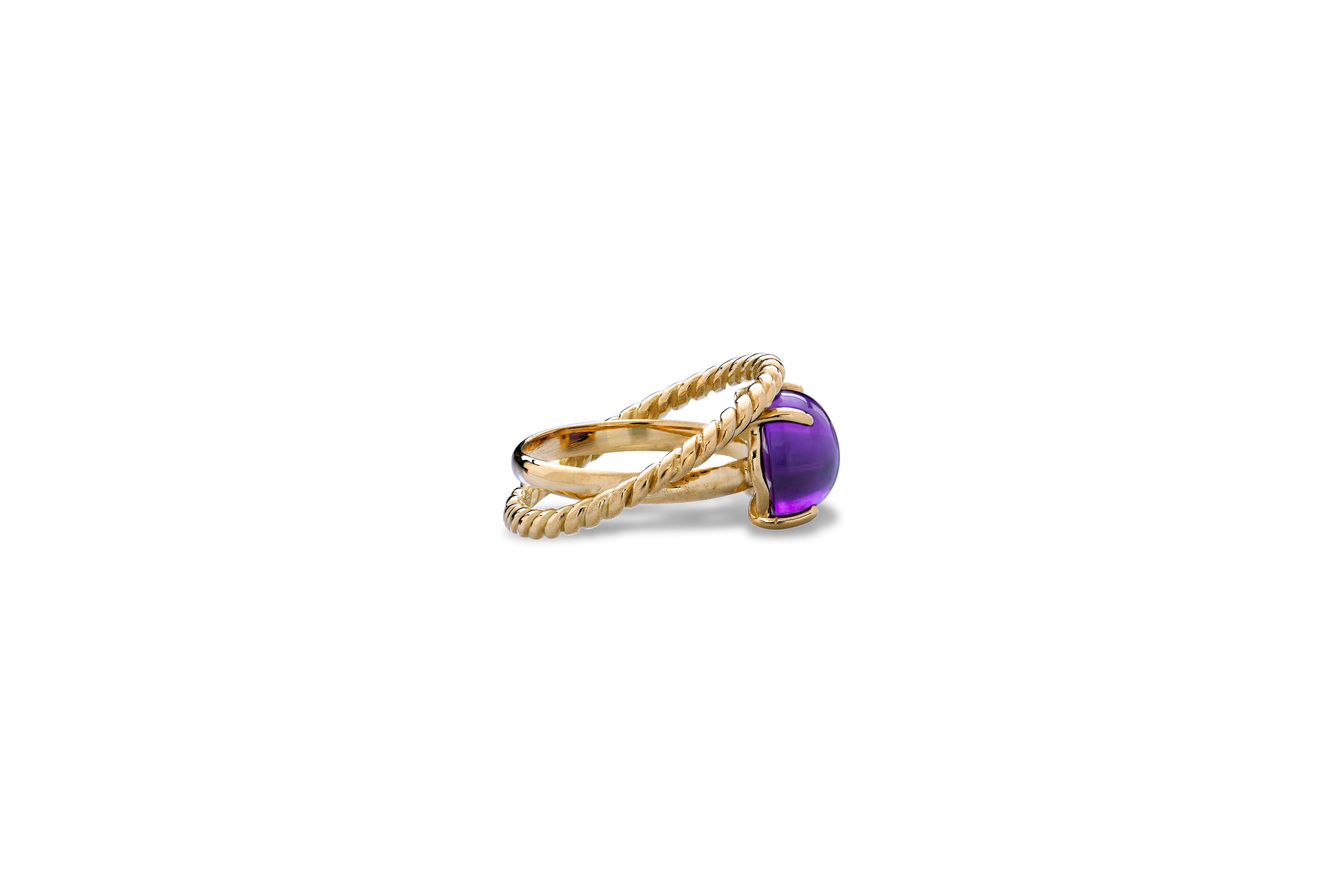 Modern 18 Karat Yellow Gold Twist Love Amethyst Handcrafted Design Ring.
This ring is handcrafted with two strips intertwined together in solid 18 karats yellow gold. 
A modern style design ring with an oval cabochon amethyst, inspired by the union