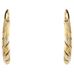 Boucles d'oreilles modernes en or jaune et blanc 18 carats à anneau torsadé