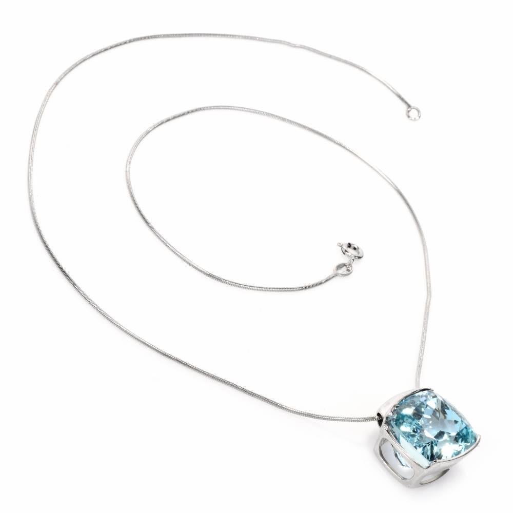 This elegant  estate aquamarine necklace crafted in 18-karat white gold comprises a captivating 18.44 carat cushion-cut aquamarine of sky blue color and a very fine snake pattern18-karat white gold chain and secures with a spring-ring clasp. It