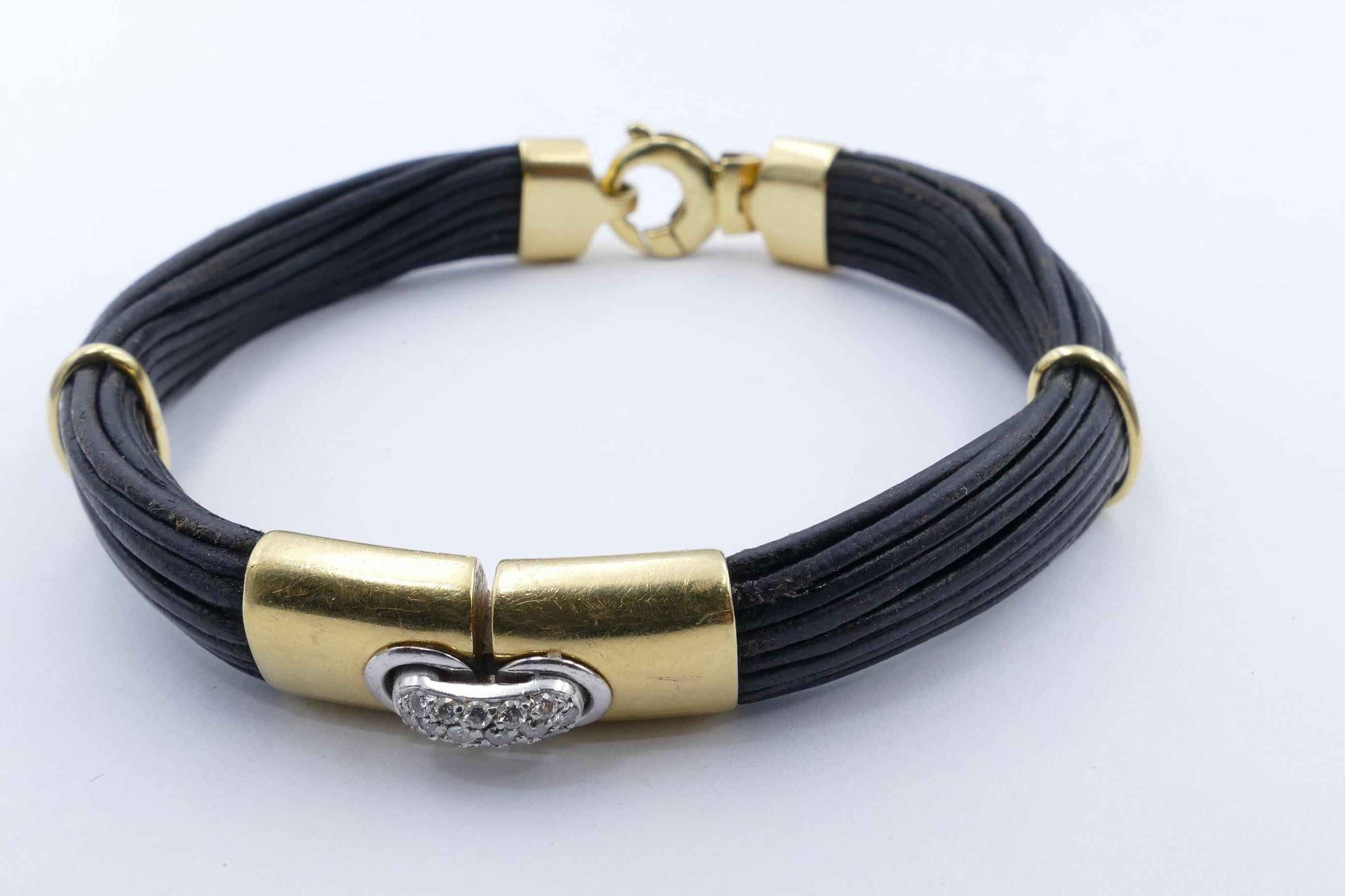 How very smart & versatile is this Leather & Gold Bracelet. Can be worn with every look.
16 round brilliant cut Diamonds are pave set in 18ct White Gold. Good colour - G?H, Clarity SI1-SI2.
The Leather Bracelet is held together by Gold bands.
It