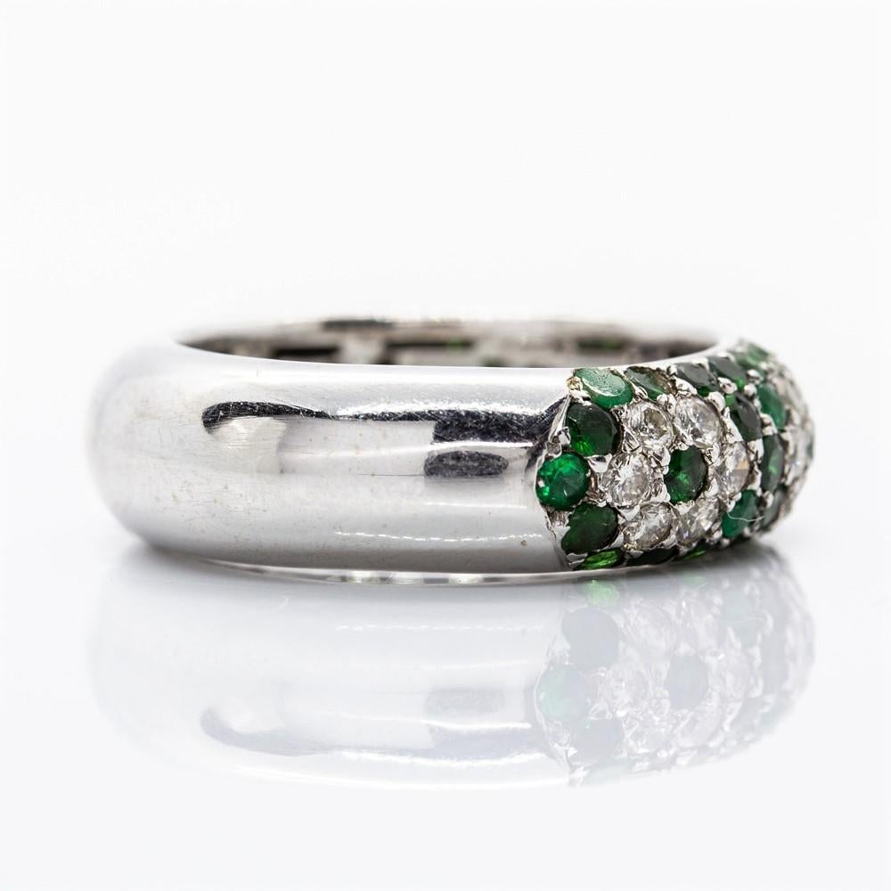 Made of solid platinum, this gorgeous piece of jewelry shows 24 full cut diamonds of H-VS2 quality that weigh 0.55ctw.
Embellishing this stunning design, this gorgeous ring displays 48 round cut natural emeralds that weigh 1.13ctw.
Ring size: 6 ½ 