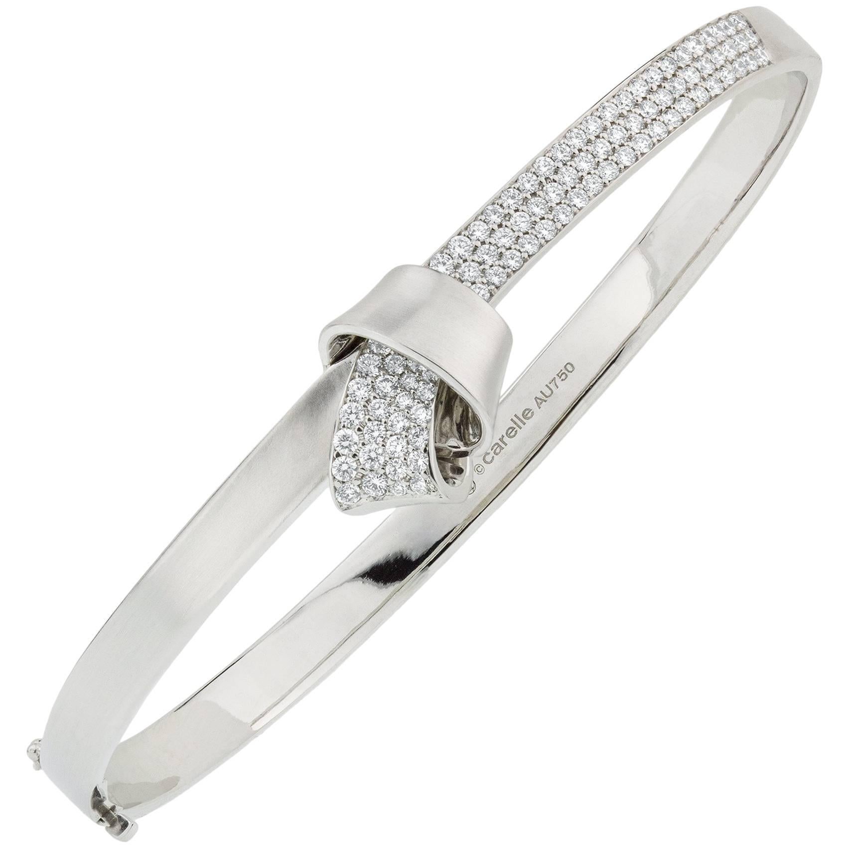 Modern 18K White Gold and 1.03 Carat Diamond Carelle Knot Pave Bangle Bracelet For Sale