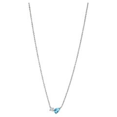 Modern 18k white gold necklace with a pear-cut aquamarine and round diamond