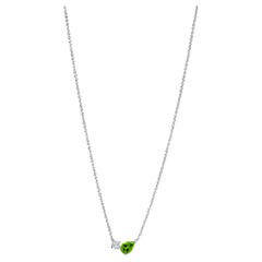 Modern 18k white gold necklace with a pear-cut Peridot and a round diamond