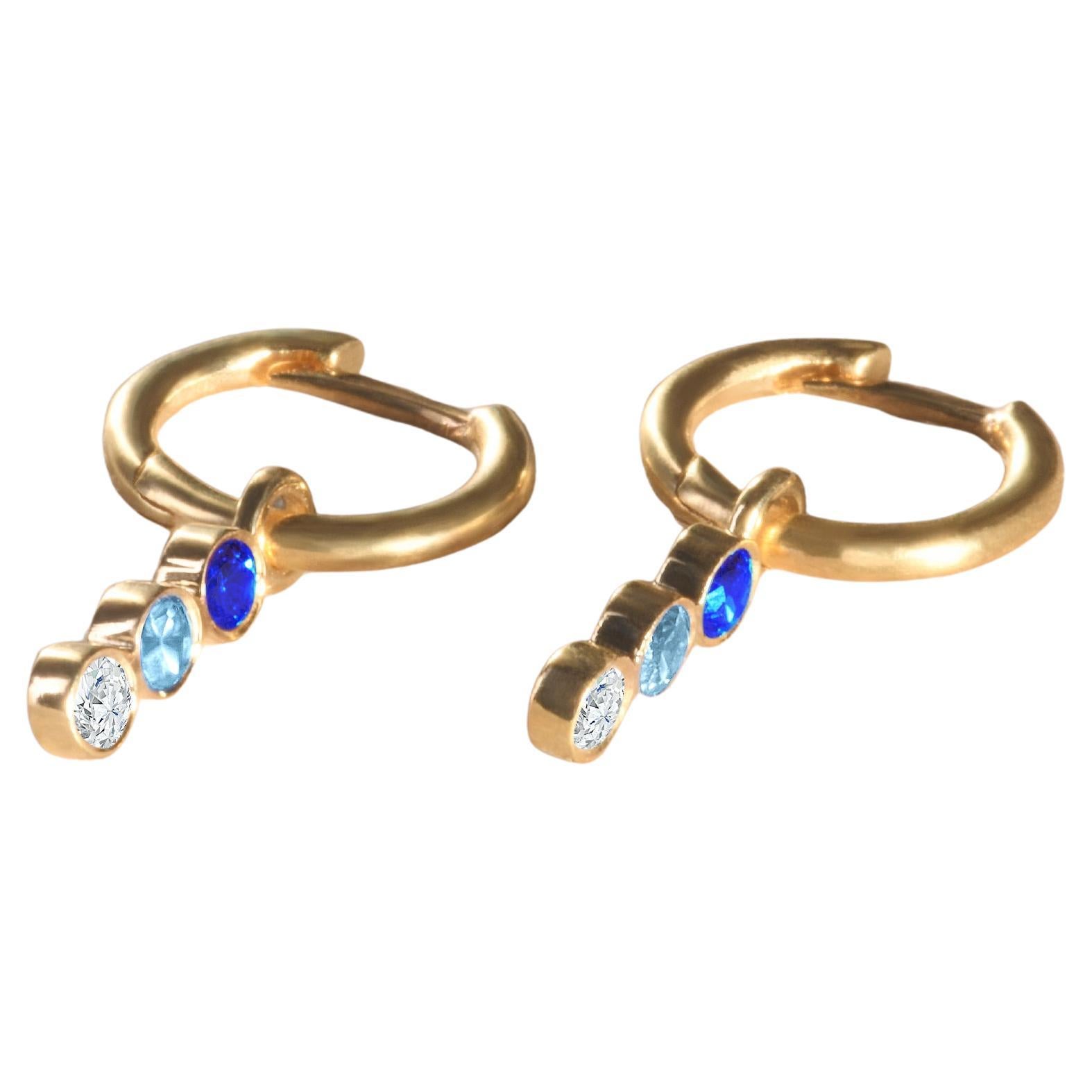 Modern 18k yellow gold earrings with blue sapphire, aquamarine and diamond