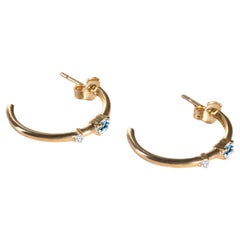 Moderne halber offene Reifen aus 18 Karat Gelbgold mit Aquamarin im Ovalschliff und Diamanten