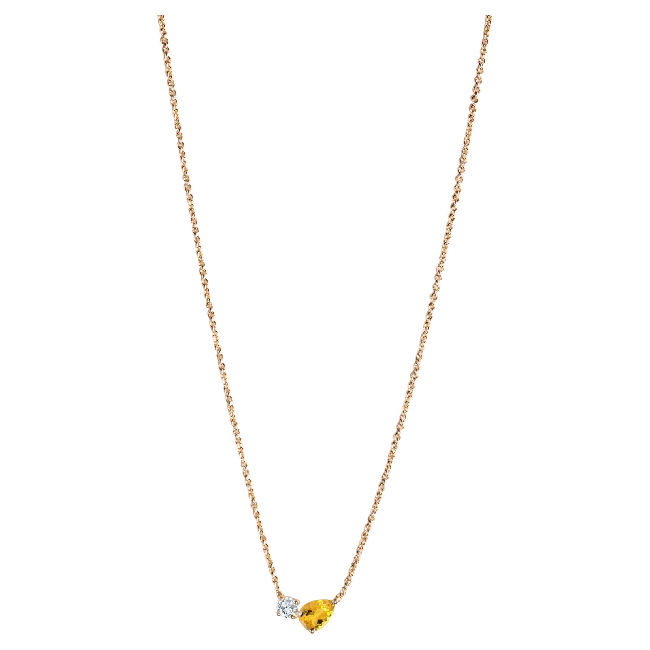 Modern 18k yellow gold necklace with a pear-cut citrine and round diamond