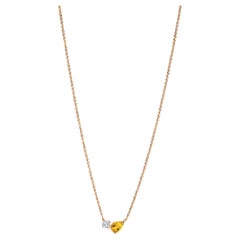 Modern 18k yellow gold necklace with a pear-cut citrine and round diamond