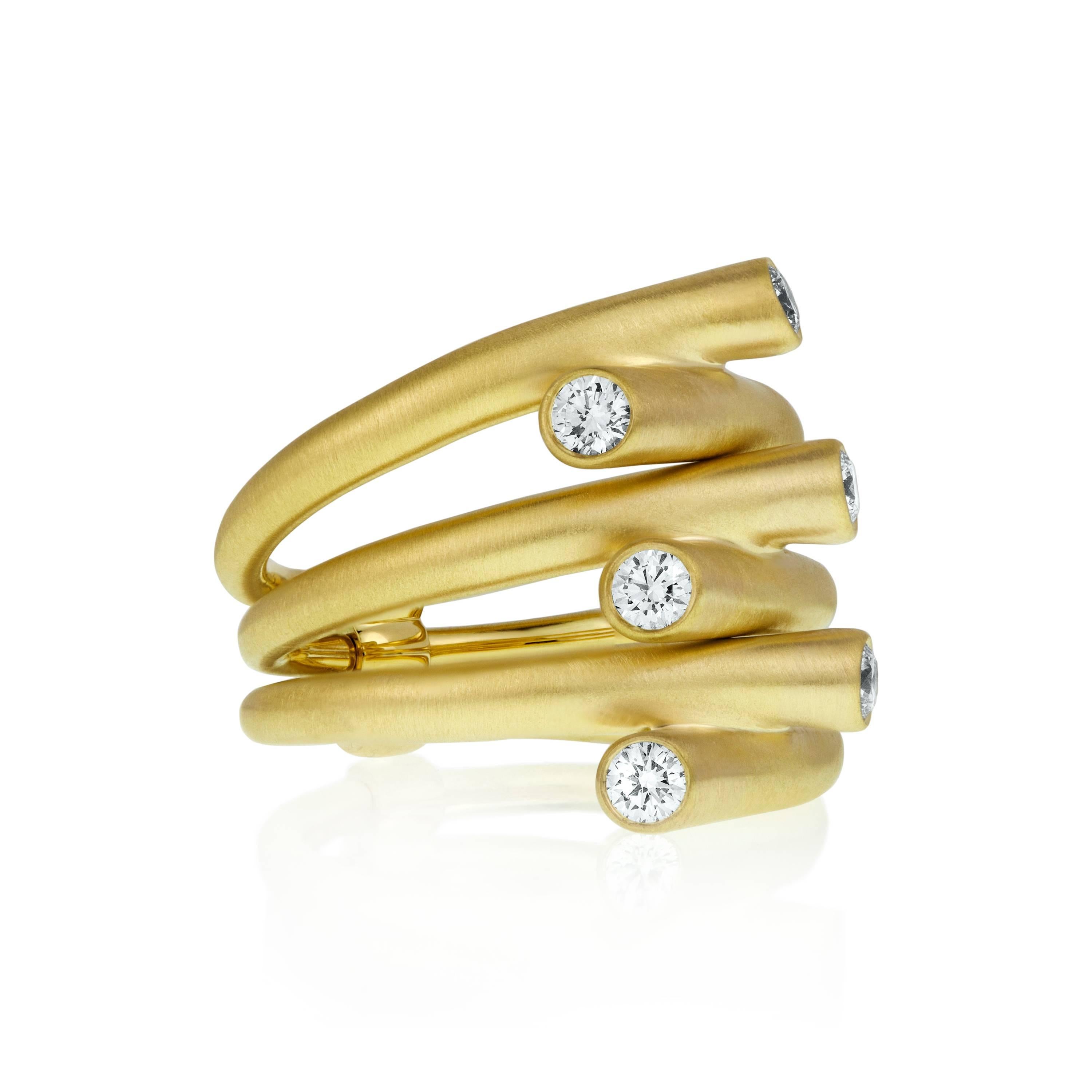 Impossibly chic, three fluid 18 karat yellow gold bands connect in the iconic Whirl Diamond Ring, showcasing six brilliant round GH-VS quality diamonds with a total weight of 0.48ct , for around the clock effortless glamour. 

Made-to-order, this