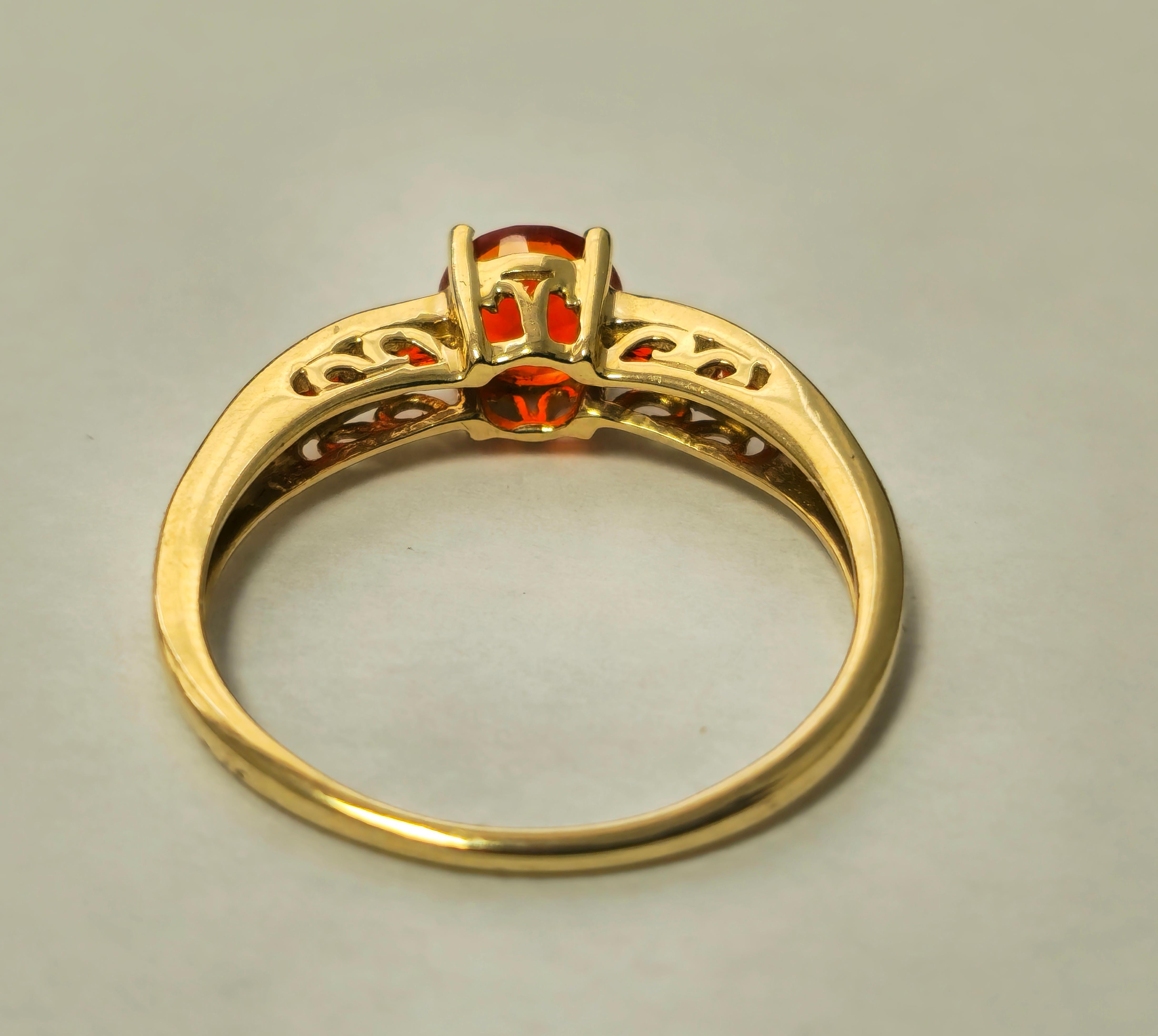 Indulge in radiant warmth with our 14k Yellow Gold Orange Sapphire Ring, showcasing a total gemstone weight of 1.90 carats. Each round-shaped sapphire exudes a vibrant hue, set elegantly in 14k yellow gold. With a total weight of 2.40 grams and a