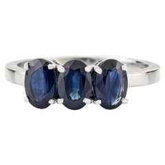 Modern 2 Carat Oval Cut Deep Blue Sapphire Three Stone Ring in 14K White Gold