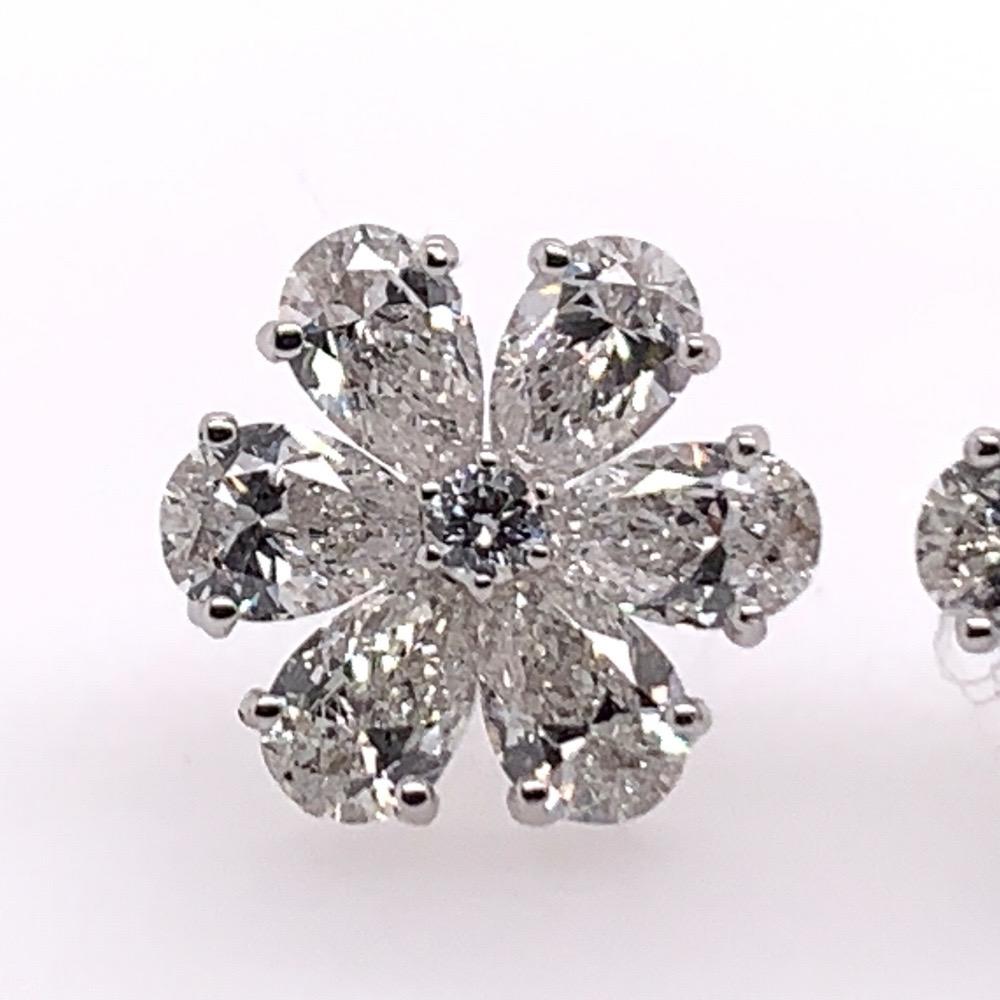 Stunning 14k Gold Floral Natural Diamond Earrings approximately F in color and VS in clarity. 

The 2 rounds in the center are 2.1mm (0.06 carats) and the 12 pear shaped diamonds are approximately 4.5x3mm (1.96 carats).

The diameter in width is
