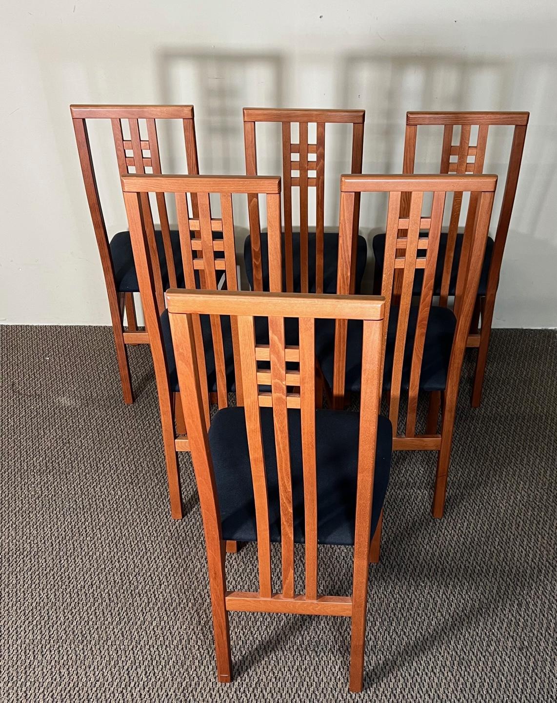 Beautiful set of 6 high back Italian dining chairs. Wood appears to be stained cherry wood. Made by IMS SRL. Made in Italy. Original label still present underneath some of the chairs. Dark blue wool upholstery. 
Stains on one of the seats. Minor